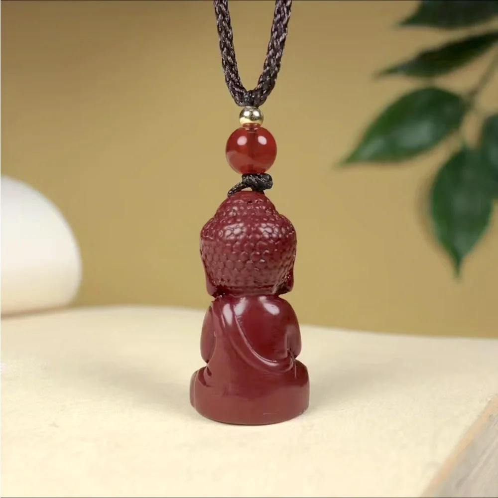 Cinnabar carved Buddha